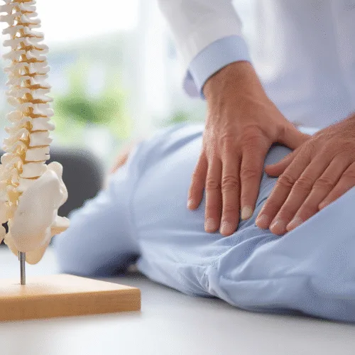 Chiropractor consulting with a patient in a bright clinic setting